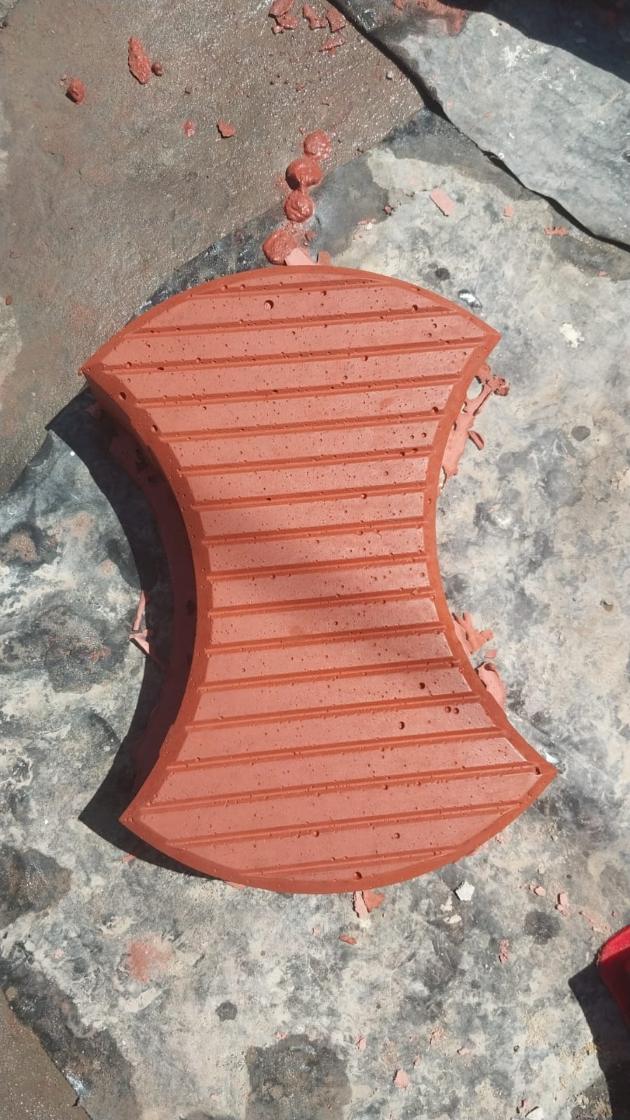 Close-up of a red ribbed paver