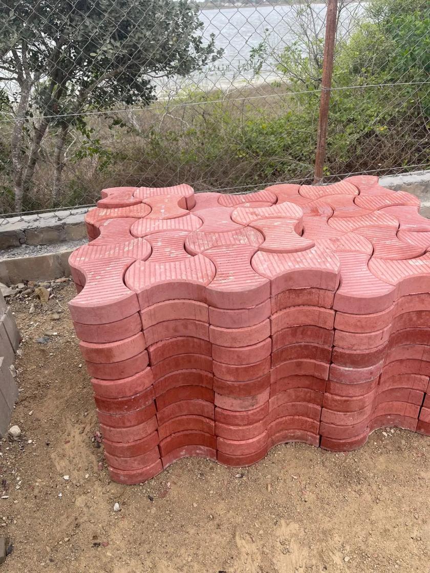 Stacked red interlocking pavers