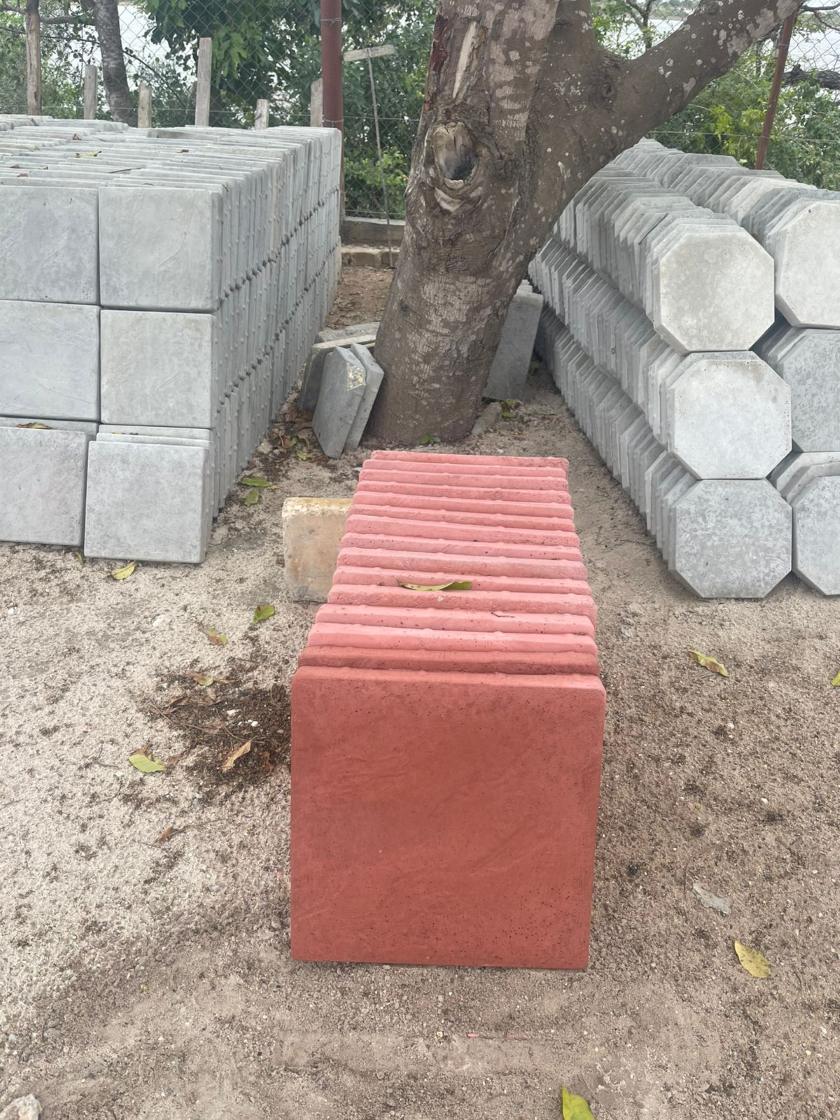 Square slabs and octagonal pavers stacked in the yard
